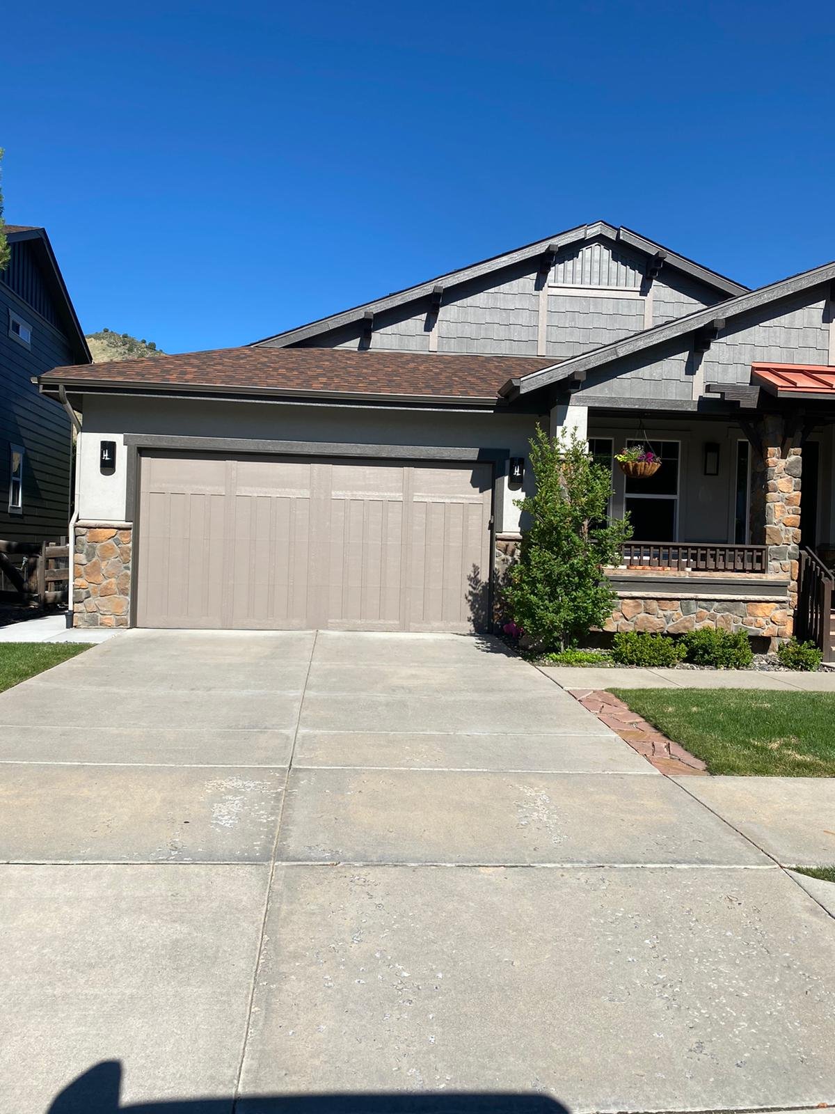 Completed residential garage door exterior — garage door repair project